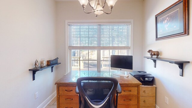 tiled home office with a chandelier