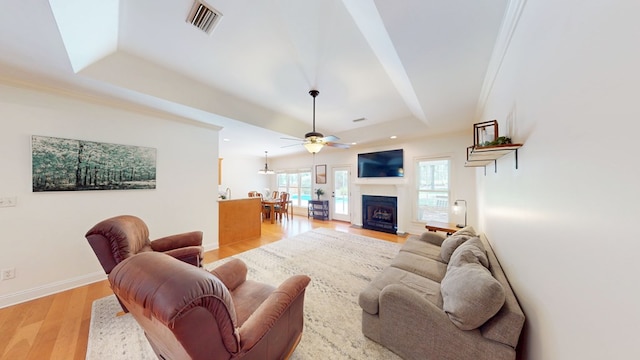 316 Bellingham Dr, Thomasville, GA 31792 - living room with a raised ceiling, ceiling fan, light wood-type flooring, a fireplace with flush hearth, and recessed lighting
