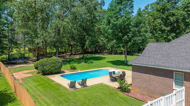 316 Bellingham Dr, Thomasville, GA 31792 - view of pool featuring a trampoline, a patio area, a fenced backyard, and view of scattered trees