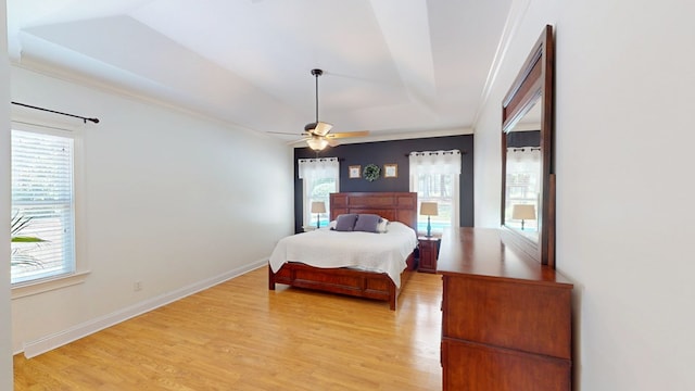 316 Bellingham Dr, Thomasville, GA 31792 - bedroom featuring light wood-style floors, a tray ceiling, crown molding, and ceiling fan