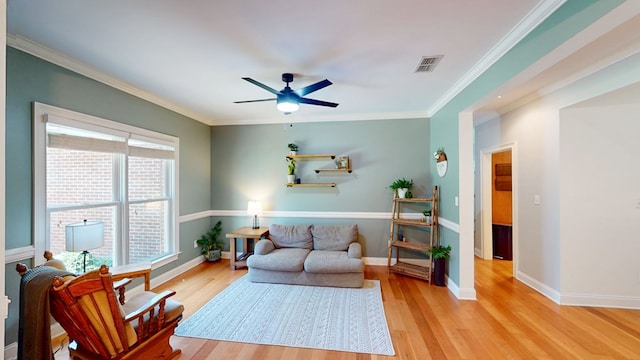 316 Bellingham Dr, Thomasville, GA 31792 - living area featuring a ceiling fan, light wood-style floors, and ornamental molding