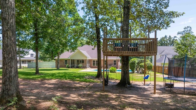 316 Bellingham Dr, Thomasville, GA 31792 - rear view of property featuring a trampoline and a deck