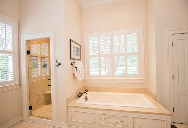 bathroom with ornamental molding and plus walk in shower