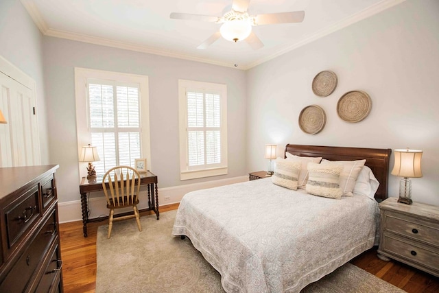 bedroom with crown molding, ceiling fan, and hardwood / wood-style floors