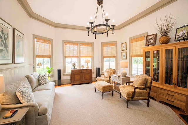 sitting room with an inviting chandelier, crown molding, and hardwood / wood-style flooring