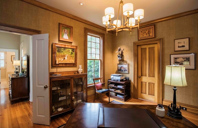 office featuring hardwood / wood-style floors, crown molding, and a chandelier