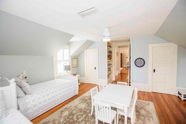 bedroom with lofted ceiling and light hardwood / wood-style flooring