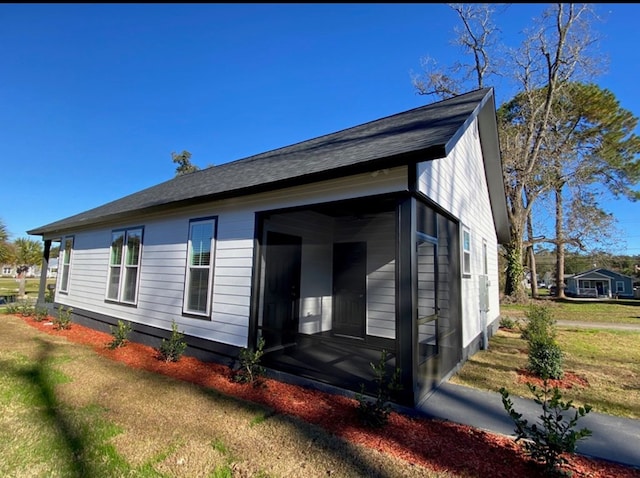 view of home's exterior featuring a lawn