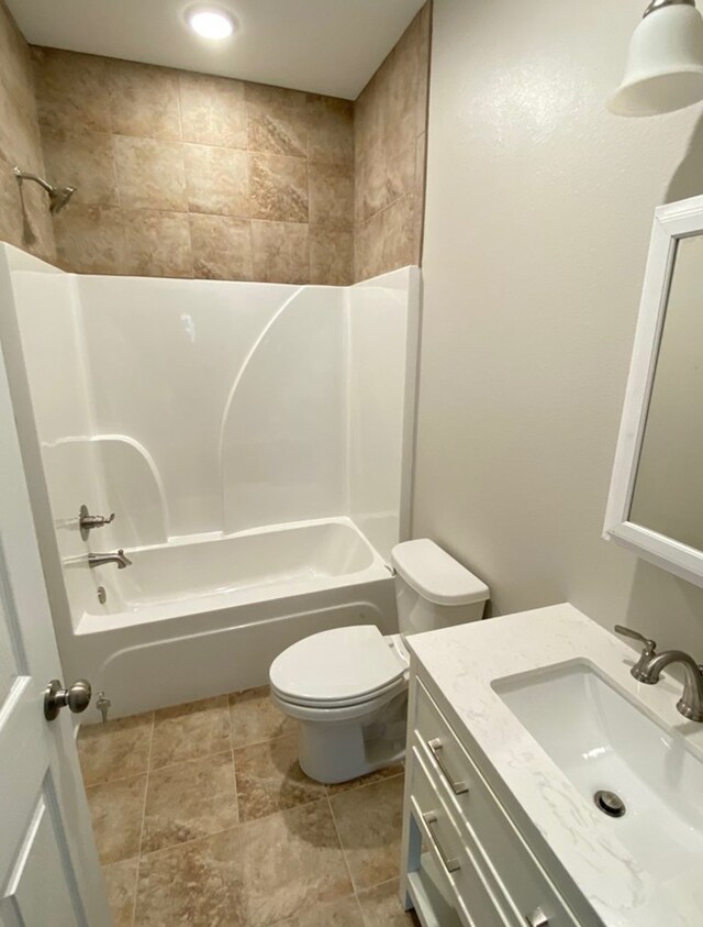 full bathroom with shower / bathtub combination, vanity, and toilet