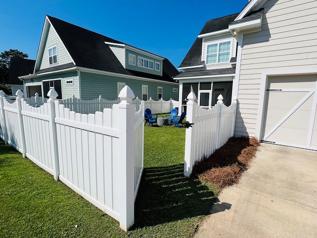 view of home's exterior featuring a garage and a yard