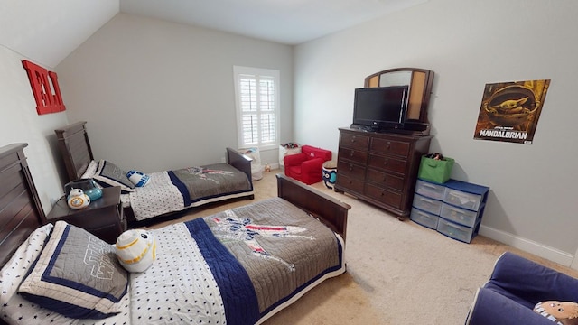 carpeted bedroom featuring lofted ceiling