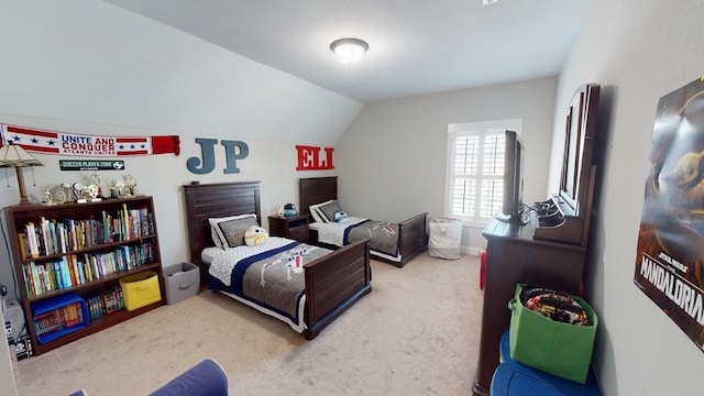 bedroom featuring carpet flooring and vaulted ceiling