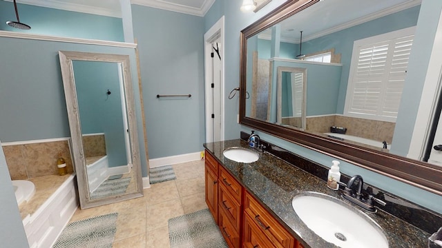 bathroom featuring tile patterned flooring, vanity, ornamental molding, and a bathing tub