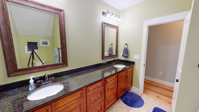 bathroom with vanity, tile patterned floors, and toilet