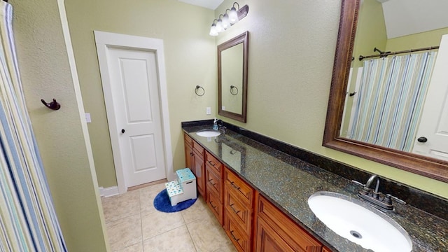 bathroom with vanity and tile patterned flooring