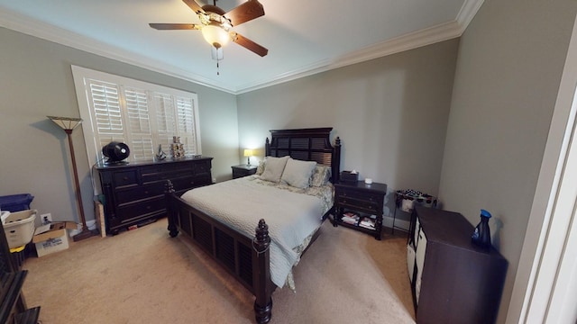 bedroom with ceiling fan, ornamental molding, and light carpet