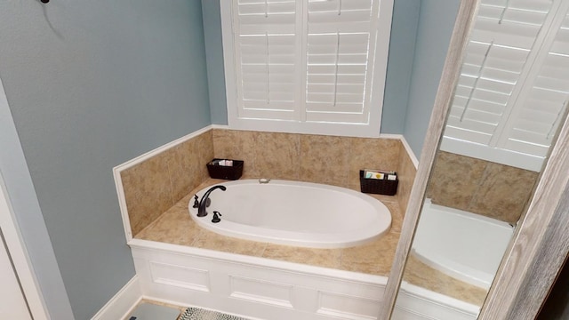 bathroom featuring a tub to relax in