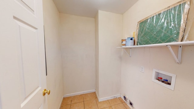 laundry room with light tile patterned floors and hookup for a washing machine