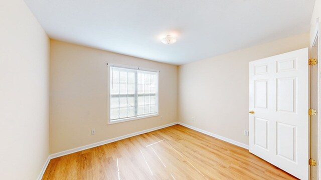 unfurnished room featuring light wood-type flooring