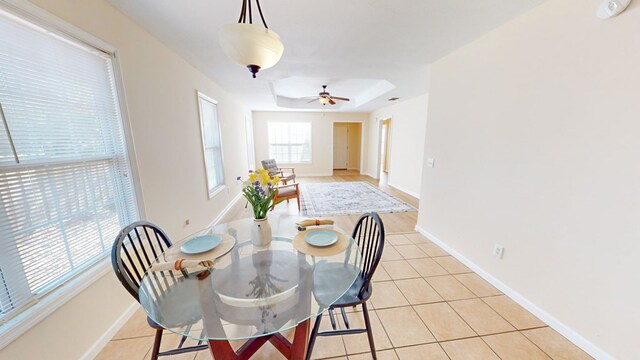 dining area featuring light tile patterned floors and ceiling fan