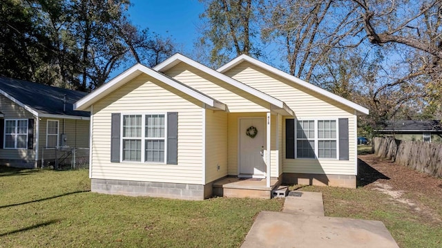 bungalow with a front yard