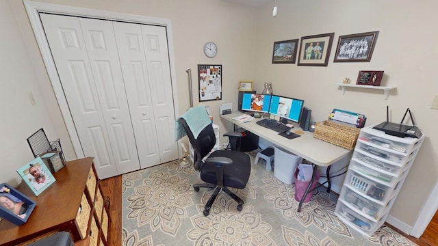 office featuring wood finished floors and baseboards