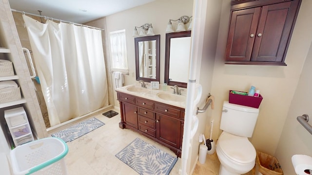 bathroom with a shower with shower curtain, a sink, and toilet