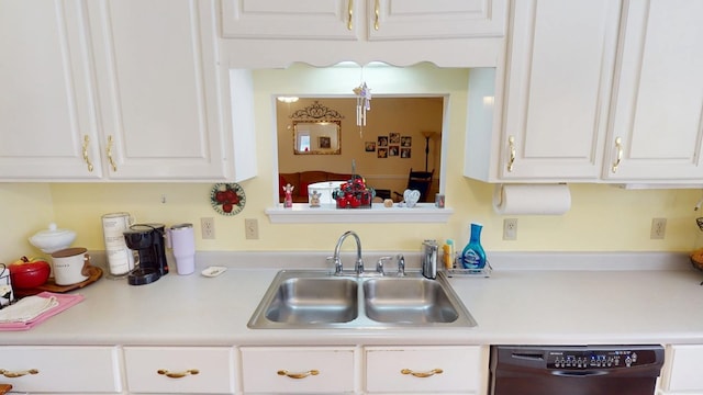 kitchen featuring a sink, white cabinetry, light countertops, and dishwasher