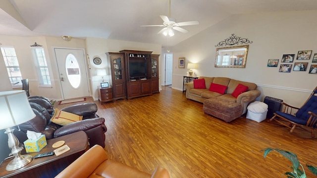 living room with vaulted ceiling, ceiling fan, and wood finished floors