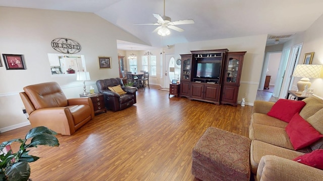 living room with baseboards, visible vents, lofted ceiling, ceiling fan, and wood finished floors