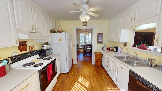 kitchen featuring light wood-style flooring, white cabinets, a sink, white appliances, and under cabinet range hood