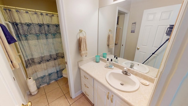 bathroom featuring a shower with curtain, vanity, toilet, and tile patterned floors