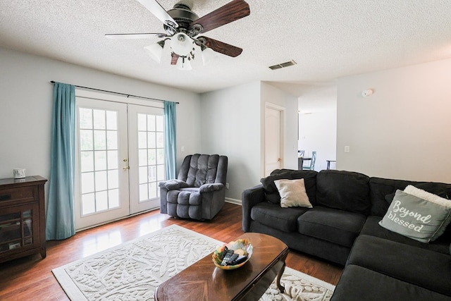 351 Plantation Ln, Thomasville, GA 31757 - living area with french doors, wood finished floors, a textured ceiling, and a ceiling fan