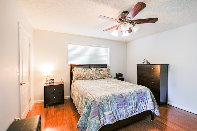 351 Plantation Ln, Thomasville, GA 31757 - bedroom with wood finished floors, a textured ceiling, and a ceiling fan