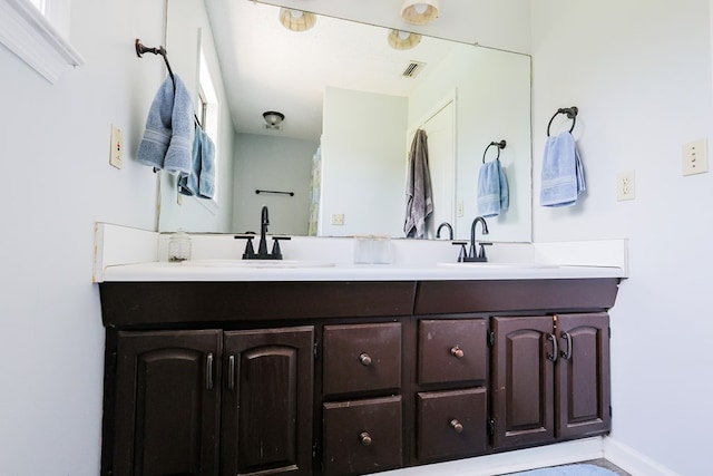 351 Plantation Ln, Thomasville, GA 31757 - bathroom with double vanity and baseboards