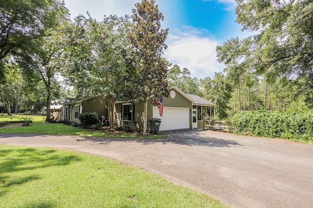 351 Plantation Ln, Thomasville, GA 31757 - view of front of home featuring driveway, an attached garage, and a front lawn