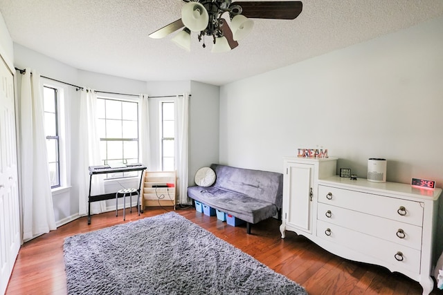 351 Plantation Ln, Thomasville, GA 31757 - bedroom featuring dark wood finished floors, a textured ceiling, and ceiling fan