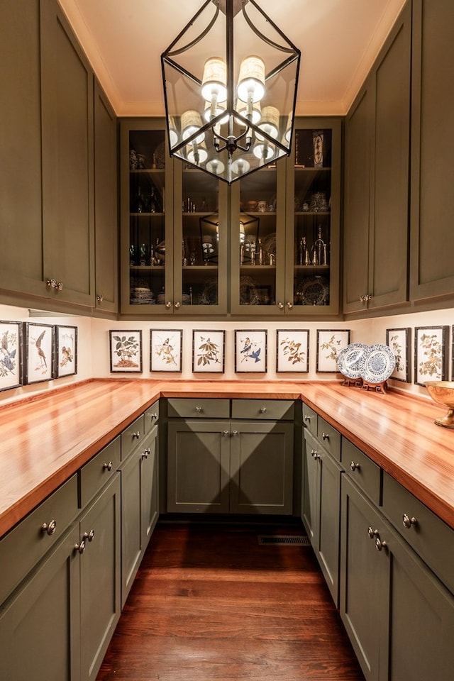 bar featuring pendant lighting, butcher block countertops, and dark hardwood / wood-style floors