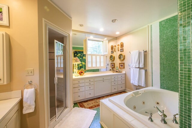 bathroom featuring vanity and shower with separate bathtub