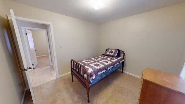 bedroom featuring light carpet