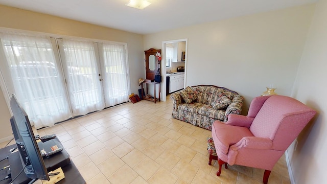 sitting room featuring light tile patterned floors