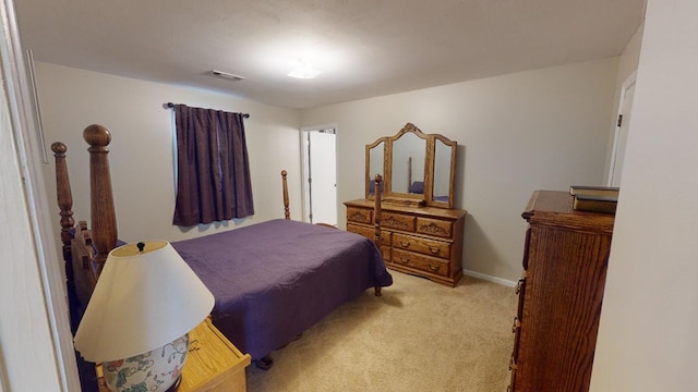 bedroom with light colored carpet