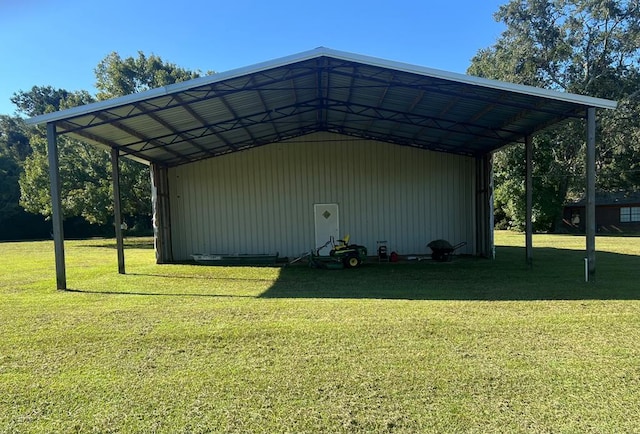 view of outbuilding with a carport and a lawn