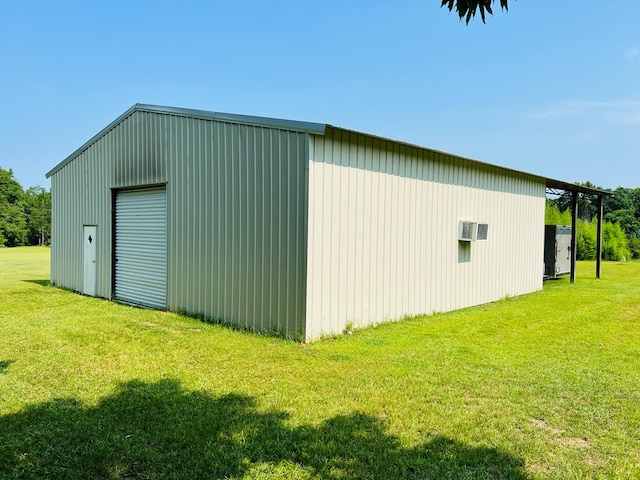 view of outbuilding with a yard