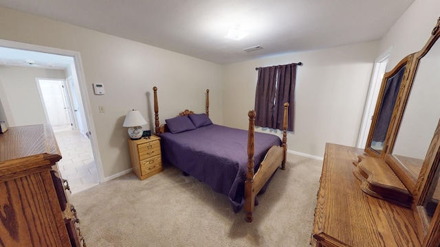 bedroom with light carpet