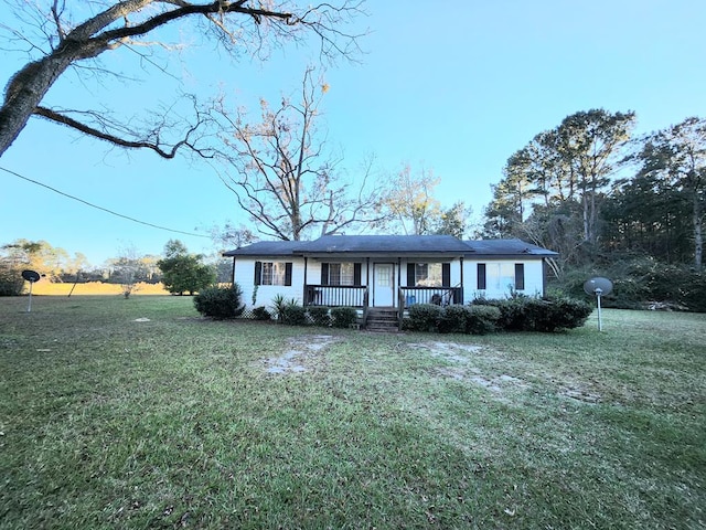 single story home with a front lawn and a porch