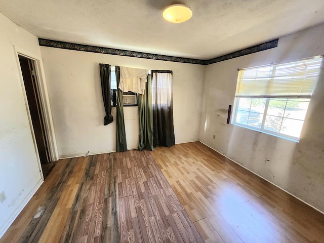 spare room with hardwood / wood-style flooring