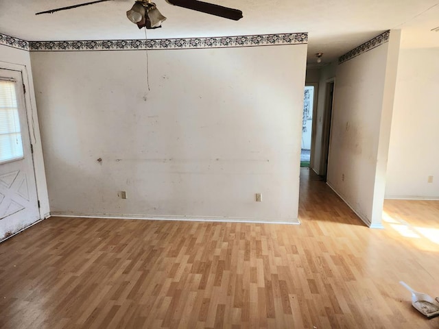 spare room with ceiling fan and light hardwood / wood-style flooring