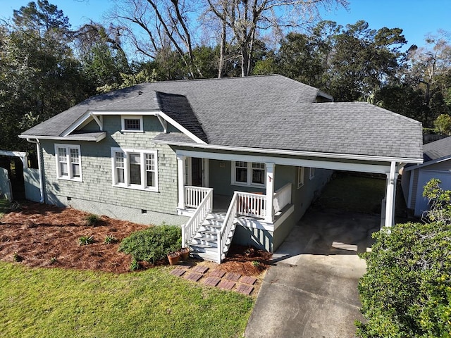 view of front of property featuring crawl space, covered porch, concrete driveway, and a shingled roof