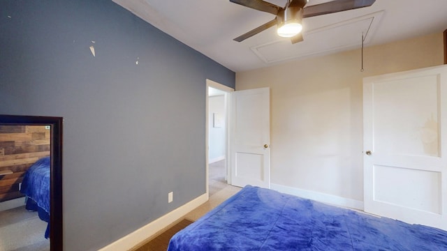 bedroom with ceiling fan and baseboards